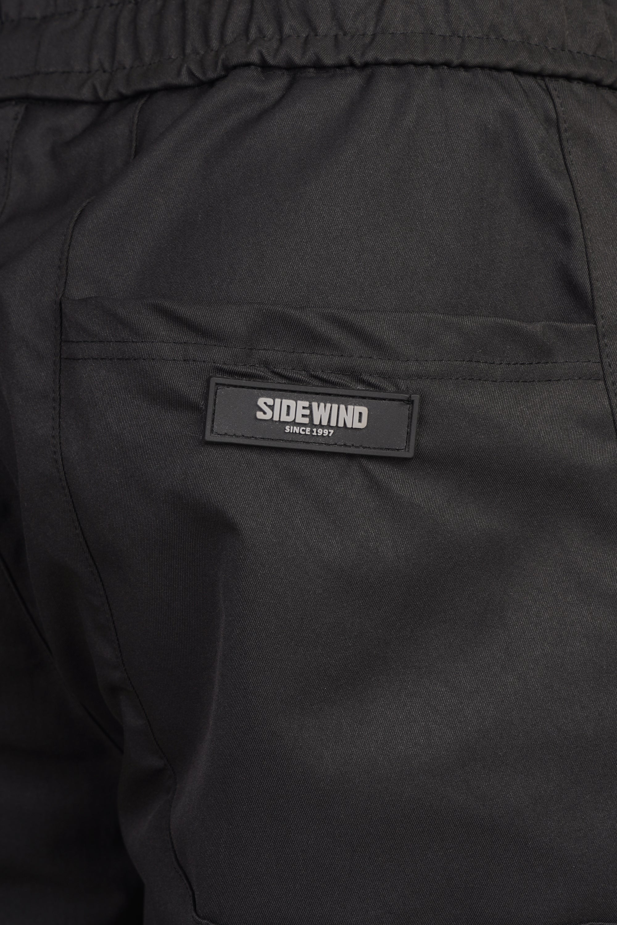SIDEWIND Panel Stitch Relaxed Pants - Black back view